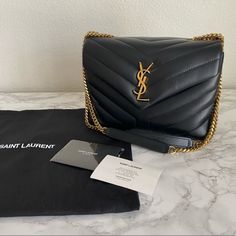 Excellent Condition Ysl Loulou Bag With Very Minor Creases In Leather Which You Can See In The Photos. Very Spacious And Can Hold All Your Necessities And Small Digital Camera Two Compartments With Zipper Pocket In The Middle Comes With Care Cards And Dust Bag, No Box Black Leather And Gold Hardware Can Wear As Shoulder Bag Or Crossbody Bag Since The Straps Are Adjustable To Two Lengths Dimensions: 9 X 6.6 X 3.5 Inches Chain Length: 11.8 To 22 Inches Ysl Loulou Bag, Small Digital Camera, Chain Lengths, Chain Length, Digital Camera, Gold Hardware, Zipper Pocket, Calf Skin, Crossbody Bag