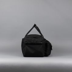 Introducing the pinnacle of travel companions: The Ultimate 30L Duffle Bag made with 1000D Oxford Waterproof Material and YKK Zippers and Clamps. This exceptional bag is meticulously designed to cater to all your needs, from jet-setting adventures to gym sessions and beyond. If anyone can make a duffle bag better, its WOLFpak! Unmatched Versatility: With a spacious 30-liter capacity, this duffle bag offers ample space for all your essentials, ensuring you're prepared for any journey. Its adaptab Black Sporty Travel Accessories For Outdoor, Black Sporty Outdoor Travel Accessories, Durable Black Travel Accessories For Outdoor, Black Travel Bag For Overnight Trips, Black Standard Backpack For Overnight Trips, Black Backpack For Overnight Trips, Practical Black Standard Backpack Luggage, Black Practical Standard Backpack Luggage, Durable Functional Travel Bag For Hiking