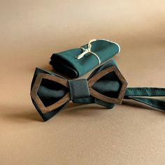 Emerald bow tie with pocket square Wooden bow tie Emerald green wedding bow ties for men  Wedding emerald green bow tie and pocket square Groomsmen proposal gift box set Wooden bow tie packaged in a beautiful black box with a bow. You will have a perfect groomsmen gift! Their accessories are handmade and created with colossal love! Colors will suit costumes for your wedding day! There may be some color discrepancies due to the different monitor settings. If you want another color, write a message! Only natural materials are used. Paint that is used for painting on a wooden bow tie will not dirty your shirt, and also it doesn't have a smell. In high-quality 3mm plywood! Size bow tie 4x2 inch ( 10,5 x 5cm) Neck 14 - 20,5 inch (35,5 - 52 cm ) Emerald Green Wedding, Groomsmen Proposal Gifts, Bow Ties For Men, Green Bow Tie, Emerald Green Weddings, Wooden Bow Tie, Wooden Bow, Ties For Men, Groomsmen Proposal