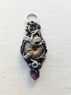 Handmade Polymer Clay Crystal Pendant with Amethyst, Ammonite and Peridot Necklace Nickel-free Amethyst Jewelry, Unique Amethyst Nickel-free Jewelry, Purple Soldered Pendant Jewelry, Soldered Purple Pendant Jewelry, Unique One-of-a-kind Amethyst Jewelry, One Of A Kind Amethyst Jewelry, Nature-inspired Amethyst Healing Jewelry, Handmade Green Amethyst Gemstones, Nature-inspired Round Pendant Jewelry For Crafting