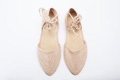 Raffia woven lace up flats made by hand. Soft padded leather insole. Woven Flats, Casual Closed Toe Lace-up Sandals With Woven Sole, Elegant Flat Lace-up Shoes For Summer, Beige Lace-up Shoes For Summer, Elegant Summer Flat Lace-up Shoes, Elegant Summer Lace-up Flat Shoes, Beige Woven Leather Flats, Elegant Summer Lace-up Shoes, Summer Lace-up Shoes With Leather Sole