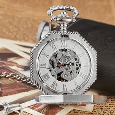 The Steampunk look is sophisticated and elegant. You won't miss it with this Roman pocket watch. Introducing our Roman Steampunk Pocket Watch - an exquisite vintage accessory with Roman numeral dial. Comes with a matching chain and elegant presentation box. Perfect for Steampunk enthusiasts or as a thoughtful gift. Order now and make a timeless statement of style! Features: Movement: hand-wound mechanical Case materials: Stainless steel Dial diameter: 1.9inch Chain length: 11.8inches | 30cm Luxury Pocket Watch With Metal Dial As Gift, Luxury Classic Pocket Watch With Automatic Movement, Luxury Pocket Watch With Metal Dial For Gift, Luxury Elegant Pocket Watch With Subdials, Luxury Hallmarked Pocket Watch For Formal Occasions, Luxury Elegant Pocket Watch With Metal Dial, Elegant Luxury Metal Dial Pocket Watch, Luxury Hallmarked Timeless Pocket Watch, Cheap Vintage Pocket Watch For Gift