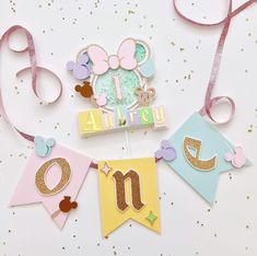 a birthday banner with minnie mouse decorations on it