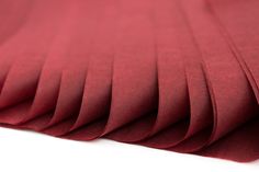 red fabric folded on top of each other