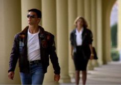 a man and woman walking down the street