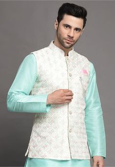 Art Silk Nehru Jacket in Off White This Readymade Sleeveless attire is Enhanced with Buttons and Resham Work. Crafted in Chinese Collar Neck Do note: Brooch and Kurta shown in the image is for presentation purposes only. Half to one inch may vary in measurement. (Slight variation in actual color vs. image is possible) Spring Wedding Nehru Jacket With Traditional Drape, Spring Wedding Bandhgala With Traditional Drape, White Sleeveless Kurta With Zari Work, Embroidered Nehru Jacket For Reception And Festivals, Festival Embroidered Nehru Jacket For Reception, Embroidered Nehru Jacket For Festivals And Receptions, White Sherwani With Zari Work For Spring, White Bandhgala For Spring Designer Wear, Designer Nehru Jacket With Cutdana For Spring