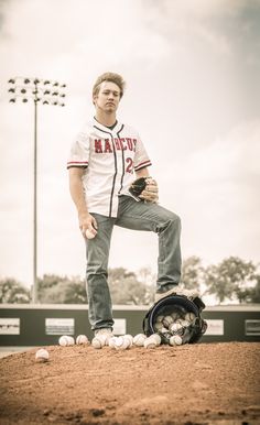 a baseball player standing on the mound with his glove