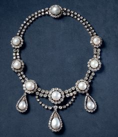 Vintage Inspired Queen  Margrethe II cubic zircon pearl necklace  for women Handmade Metal: Sterling Silver  Metal Purity:925 Metal weight: 75.99 gram Stone: Cubic  Stone Ctw:25.90ctw Gemstone: Pearl Gemstone weight: 12.989 ct Item length:.17 inch Formal Pear-shaped Diamond Pearl Necklace, Pear-shaped Diamond Necklace With Pearl Drop, Fine Jewelry Cubic Zirconia Necklace With Pearl Drop, Silver Pearl Necklace With 17 Jewels For Anniversary, Formal Silver Pearl Necklace With Jewels, Silver Jeweled Pearl Necklace For Formal Occasions, Diamond White Necklaces With Pearl Drop, Diamond White Necklace With Pearl Drop, Formal Necklace With Pearl Chain And Cubic Zirconia