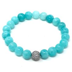 Precious looking dyed Amazonite gemstones bracelet ● elegant, simple and meaningful! Amazonite is a very ancient gemstone that's known for its beauty and healing properties. It helps with physical ailments, emotional issues, and in Energy Healing and chakra balancing. Amazonite crystal therapies are primarily associated with filtering out stresses, healing traumas, and soothing energies in the home and workplace.Materials:- 8mm high quality dyed amazonite beads- 8mm metal bead pave with zircon** Elegant Amazonite Bracelet For Healing, Amazonite Gemstone Beads Bracelet For Healing, Amazonite Crystal, Bracelet Elegant, Amazonite Necklace, Metal Bead, Crystal Therapy, Chakra Balancing, Seed Bead Jewelry