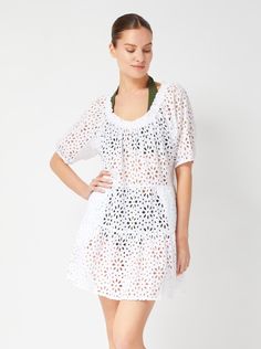 This Change of Scenery cotton eyelet style is a versatile dress you’ll reach for time and time again. Featuring a rounded neckline and short puff sleeve, this embroidered knee-length dress pairs an easy, relaxed silhouette with a customizable fit. Wear it on the shoulder, off one-shoulder, or off both shoulders. Easily slips on and off a coordinating swimsuit, so all you’ll need to complete the look is your favorite pair of flat sandals. Unlined, covered elastic neckline, can be worn on or off t Cotton Crochet Dress For Daywear, White Eyelet Dress For The Beach, Summer Eyelet Dress With Short Sleeves, Casual Crochet Dress With Short Sleeves For Summer, Short Sleeve Eyelet Dress For Daywear, Short Sleeve Crochet Dress For Summer Vacation, Short Sleeve Eyelet Dresses For The Beach, Spring Beach Crochet Dress With Short Sleeves, White Crochet Dress With Short Sleeves For Summer