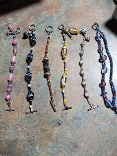 "These are beautiful Handmade bracelets. 2 are 8\", the black and white and blue and pink double strand. 1 is 7 1/2\" the yellow, white and clear. 3 are 7\" the opal and silver, orange, brown and yellow and the pink and silver. All beaded with strong beading wire and have the toggle clasps." Assorted Adjustable Spiritual Jewelry, Assorted Adjustable Bracelet Jewelry, Adjustable Assorted Color Bracelet Jewelry, Adjustable Assorted Color Bracelet, Adjustable Assorted Jewelry, Bohemian Assorted Bracelets, Bohemian Assorted Color Bracelet Jewelry, Bohemian Style Assorted Color Bracelet Jewelry, Assorted Colorful Beads Bracelet