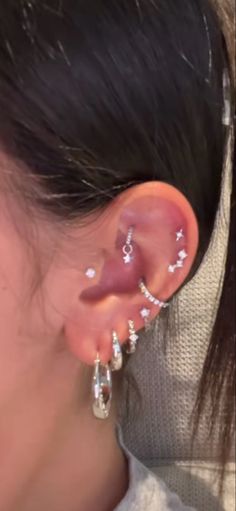 a woman with ear piercings on her ears