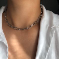 ♡ LUXX ♡ * Stunning stainless steel chain (silver) * Perfect for layering * Luxurious design * Water resistant * Total chain length: 45 cm * Adjustable * Super shiny ➪  𝐴𝑙𝑙 𝑃𝑟𝑜𝑑𝑢𝑐𝑡𝑠 𝑎𝑟𝑒 𝑐𝑎𝑟𝑒𝑓𝑢𝑙𝑙𝑦 𝑝𝑎𝑐𝑘𝑎𝑔𝑒𝑑 𝑤𝑖𝑡ℎ 𝑙𝑜𝑣𝑒.  ➪  𝑃𝑎𝑐𝑘𝑎𝑔𝑒 𝑖𝑛𝑐𝑙𝑢𝑑𝑒𝑠: 𝐼𝑡𝑒𝑚 (𝑜𝑓 𝑐𝑜𝑢𝑟𝑠𝑒), 𝑎 𝑙𝑜𝑣𝑒𝑙𝑦 𝑉𝑒𝑙𝑣𝑒𝑡 𝐺𝑖𝑓𝑡 𝑏𝑎𝑔. ✲ 𝑇ℎ𝑒 𝑟𝑒𝑐𝑜𝑚𝑚𝑒𝑛𝑑𝑒𝑑 𝑐ℎ𝑎𝑖𝑛 𝑠𝑖𝑧𝑒 𝑓𝑜𝑟 𝑡ℎ𝑖𝑠 𝑖𝑡𝑒𝑚 𝑖𝑠 40 𝑐𝑚. ♡  𝐼𝑓 𝑦𝑜𝑢 𝑎𝑟𝑒 ℎ𝑎𝑣𝑖𝑛𝑔 𝑠𝑜𝑚𝑒 𝑠 Luxury Link Cable Chain Necklaces, Modern Silver Clavicle Chain Necklace, Silver Link Chain Necklace With Adjustable Chain, Silver Metal Cable Chain Necklace, Silver Stainless Steel Paperclip Chain Necklace, Trendy Silver Box Chain Necklace, Silver Metal Chain Necklace With Rectangular Links, Silver Minimalist Chunky Chain Necklace, Silver Chunky Chain Necklace In Stainless Steel