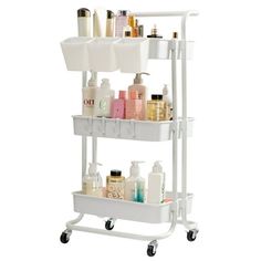 a white shelf with two shelves filled with bottles and soaps on it's wheels