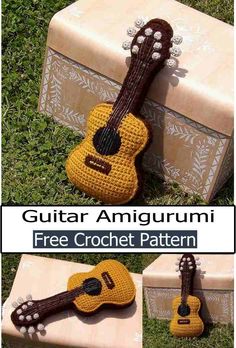 a crocheted guitar sitting on top of a box in the grass with text overlay