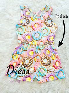 The cutest Donut romper around!  Grab one now for your little one.  Each romper is made with the softest fabric and it has pockets! Cute Summer Onesie For Playdate, Cute Jumpsuits And Rompers With Pockets For Playtime, Pink Cotton Fun Bubble Romper, Pink Cotton Bubble Romper In Fun Style, Playful Summer Onesie For Sleepovers, Cute Multicolor Jumpsuits And Rompers For Playtime, Playful Onesie For Summer Sleepovers, Fun Pink Onesie For Spring, Fun Pink Spring Onesie