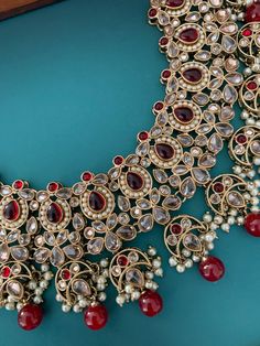 About 2 inch wide on the neck. Pearl work and glass drop. Earring is about 2 inch long and full size Tikka . Festive Chandbali Bridal Necklace With Jeweled Details, Elegant Kundan Necklace For Festivals, Traditional Teardrop Bridal Necklace For Festive Occasions, Bollywood Chandbali Heavy Choker, Traditional Chandbali Jewelry, Bollywood Chandbali Jeweled Necklaces, Bollywood Style Jeweled Chandbali Necklaces, Pearl Work, Polki Necklace