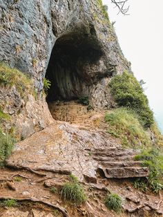 the entrance to an underground cave on top of a mountain