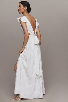 The BHLDN Short-Sleeve V-Neck Ruffle Floral Maxi Dress exudes elegance with its delicate ruffle details and captivating floral pattern, perfect for any special occasion. | Short-Sleeve V-Neck Ruffle Floral Maxi Dress by BHLDN in White, Women's, Size: 8, Polyester/Elastane at Anthropologie Flutter Sleeve Dress With Ruffles For Wedding, Elegant Flutter Sleeve Dress For Garden Party, Elegant Flutter Sleeve Dress For Brunch, Spring Wedding Dresses With Ruffle Sleeves, Wedding Dresses With Ruffle Sleeves, Chic Silk Dress With Flutter Sleeves, Elegant Ruffled Dress For Brunch, Elegant Dress With Ruffles And Flutter Sleeves, Ruffle Floral Maxi Dress