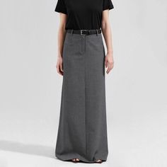 Discover Timeless Elegance Step into a world of sophistication with our Elegant High Waist Gray Long Skirt, a perfect blend of style and comfort for the modern woman. Designed for the autumn and winter seasons, this skirt is a staple for those who appreciate a touch of class in their wardrobe. Its ankle-length design, combined with a tasteful side slit, offers a perfect balance of modesty and allure, making it ideal for both office and social settings. Exceptional Design and Quality Every detail of this skirt speaks of quality and style. The empire waistline elegantly cinches at the narrowest point, creating a flattering silhouette for all body types. The woven fabric, a luxurious mix of cotton and polyester, promises both durability and comfort. This skirt's solid color and straight silho Gray Long Skirt, Corp Core, High Waist Long Skirt, Empire Waistline, Polished Look, Autumn And Winter, Modern Woman, Timeless Pieces, Long Skirt