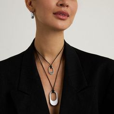 Lean into this contrasting combo, inspired by New York City: a sleek brushed pendant on a 19-inch utilitarian black cord. And with a slider for adjustable length, you can wear it your way.
Material: DD Signature brushed rhodium and high polish edges over high-quality brass.
Length: 14" - 19" (adjustable) Virtual Fashion, Long Pendant Necklace, Silver Shop, Long Pendant, Stunning Necklace, Cuff Bangles, Beauty Gift, Chain Bracelet, Silver Necklaces