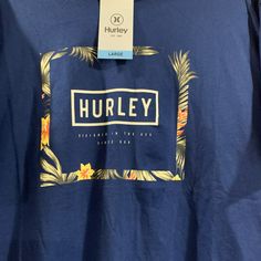 Hurley T Shirt Large Dark Blue Navy Cotton T-shirt For Spring, Blue Crew Neck Shirt With Floral Print, Blue Graphic Tee With Floral Print, Blue Floral Print Crew Neck Shirt, Blue Floral Print Graphic Tee Shirt, Blue Floral Print Graphic Tee, Blue Summer T-shirt For Surfing, Cheap Graphic Print T-shirt For Surfing, Blue Floral Print Crew Neck T-shirt