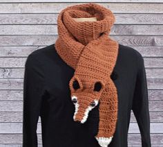 a brown scarf with an animal head on it