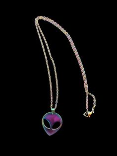 Add some excitement to your jewelry collection with this unique and colorful rainbow Alien head pendant and chain. The chain is 18 inches total length and is colored like the pendant. This necklace will be a beautiful statement piece. Makes a great gift. Necklace comes on a card and in a cellophane bag, ready to give as a gift. Multicolor Metal Pendant Charm Necklaces, Purple Metal Chain Necklace Gift, Purple Metal Chain Necklace As Gift, Rainbow Metal Jewelry With Adjustable Chain, Rainbow Chain Necklace As Gift, Multicolor Pendant Charm Necklace As Gift, Rainbow Chain Necklace For Gift, Unique Multicolor Necklaces, Nickel-free Multicolor Metal Necklaces