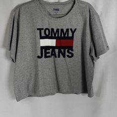 Grey Tommy Jeans Crop Tee Sz Lg. 100% Cotton For Easy Care And Comfort Nwt Never Worn. Iconic Graphic Logo. Trendy Summer Tops With Logo, Relaxed Fit Summer Tops With Logo, Summer Tops With Logo In Relaxed Fit, Summer Relaxed Fit Tops With Logo, Spring Cotton Tops With Logo, Spring Cotton Top With Logo, Summer Crew Neck Top With Logo, Summer Logo Tops With Crew Neck, Trendy Tommy Hilfiger Cotton T-shirt