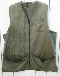 Used vintage hunting vest.  Has some repairs and modifications, see all pictures and close-ups.  Tagged size XL, but had side panels added so it's somewhat larger now.  Zipper works.  Examine all 12 pictures (they enlarge), they are part of the description and shows the condition and details of the item.  Contact me with any questions.  No returns.  Hanger not included.    U.S. sales only.  Payment must be received within 3 days.  Thanks for looking and please check our other listings. Vintage Cotton Vest For Outdoor, Vintage Khaki Vest With Pockets, Vintage Green Cotton Vest, Green Cotton Vest With Pockets, Military Style Green Sleeveless Vest, Green Military Sleeveless Vest, Retro Green Cotton Vest, Vintage Khaki Vest For Outdoor, Green Sleeveless Vest For Outdoor Activities