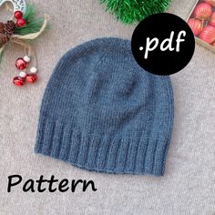 a knitted hat with the word pattern next to it and other christmas decorations around it