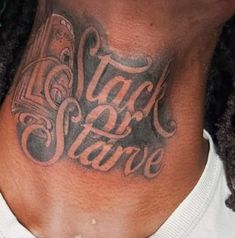 a man with a neck tattoo that says i am slave