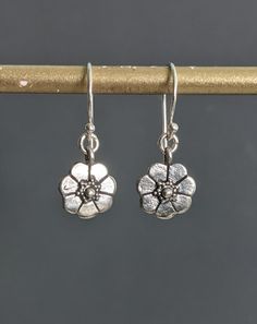 "Flower Silver Earrings, Tiny Oxidized Bali Sterling Silver Earrings, Delicate Flower Earrings, Charm Floral Boho Botanical Dangle. Total Length: 1 1/10\" ( 28 mm.) * Processing time is 3 - 5 days.  * US orders are shipped first class mail. * International orders are shipped first class international. * Shipping upgrades are available at checkout. Thank you for visiting my listing! Have a wonderful day!" Metal Flower Charm Drop Earrings, Metal Drop Earrings With Flower Charm, Delicate Nickel-free Dangle Flower Earrings, Silver Teardrop Earrings With Flower Charm, Sterling Silver Adjustable Drop Flower Earrings, Adjustable Nickel-free Flower Earrings, Adjustable Sterling Silver Drop Flower Earrings, Adjustable Hypoallergenic Dangle Flower Earrings, Silver Teardrop Flower Earrings With Flower Charm