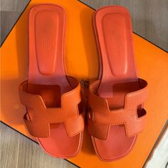 Hermes Orange Sandals Worn But In A Good Condition. No Returns Or Refunds. Final Sale! Luxury Orange Sandals For Formal Occasions, Luxury Open Heel Sandals For Vacation, Luxury Open Back Sandals For Vacation, Luxury Leather Sole Mules For The Beach, Designer Orange Sandals With Round Toe, Luxury Closed Toe Sandals For Vacation, Luxury Round Toe Mules For Beach, Luxury Orange Sandals With Removable Insole, Summer Flat Heel Sandals For Galas