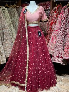 Crimson red sequence work lehenga with contrasting blush pink blouse and net dupatta. Fabric: Net This outfit can be customized in multiple colors and specific to client measurements. 90 days of production time is required and are for bulk orders only! Orders are processed in store only! Final fittings/alterations not included. Minimum Order Quantity- 4 pieces Designer Net Lehenga For Navratri, Net Anarkali Set For Wedding Party, Floor-length Net Sets With Dori Work, Wedding Party Wear Anarkali Set In Net, Designer Net Lehenga With Pallu, Designer Party Wear Red Lehenga, Designer Net Lehenga With Sheer Dupatta, Red Designer Party Wear Lehenga, Festive Net Dress With Pallu Detail