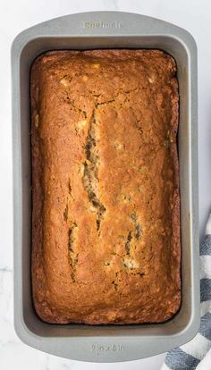 a loaf of banana bread sitting on top of a cooling rack