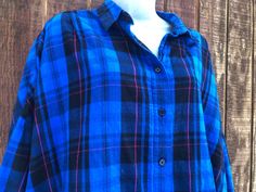 Button up plaid shirt by French Connection. Labeled size large -please see measurements. Condition- shows some wear but no major flaws. Measurements taken across front laid flat 30" armpit to armpit 30" across waist 28" length 32" shoulders 15" arm length Blue Flannel Shirt With Relaxed Fit, Blue Flannel Tops For Fall, Blue Collared Flannel Top, Blue Flannel Button-up Top, Blue Flannel Top With Button Closure, Blue Plaid Shirt, May 5, French Connection, Label Sizes