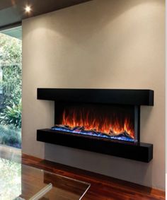 a modern fireplace in the middle of a living room