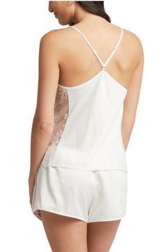 Silky charmeuse beautifully glides down your figure on this drape-neck chemise simply detailed with sheer lace sides. 23" top length; 2" inseam; 13 1/2" leg opening; 10 1/2" front rise; 12" back rise Top has drape neck; adjustable straps Shorts have elastic waist 100% polyester Hand wash, dry flat Imported Lingerie Satin Sleepwear With Built-in Bra For Wedding Night, Satin Camisole With Built-in Bra For Loungewear, Elegant Sleeveless Sleepwear With Lace Trim, Satin Cami Sleepwear For Wedding Night, Wedding Night Camisole, Sleeveless Delicate Lace Sleepwear For Wedding Night, Silk Sleepwear With Lace Trim For Wedding Night, Elegant Lace Trim Camisole Sleepwear, Satin Camisole With Lace Trim For Night