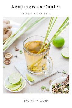 lemongrass cooler with limes and ginger on the side, in a glass mug