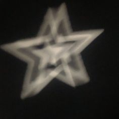 a blurry photo of a star in the dark