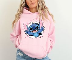 Lilo and Stitch Heart Sweatshirt, Shirt, Hoodie, Valentine's Day Gift for Her, Gift for Girlfriend, Valentine's Day Youth Hoodie, Couple Tee Sweatshirts (no hood) & Hoodies (with hoods) M A T E R I A L S * Gildan® Heavy Blend™ Adult Hooded Sweatshirt * 50% Cotton / 50% Polyester * Classic Fit * Fabric 271 g/m² * Preshrunk fleece knit * Double-lined hood with color-matched drawcord * Double needle stitching at shoulder, armhole, neck, waistband and cuffs * Pouch pocket * 1 x 1 rib with spandex * Air jet yarns = softer feel and reduced pilling * Tear away label Unisex Short Sleeve Tee * 100% Airlume combed and ringspun cotton (fiber content may vary for different colors) * Light fabric (4.2 oz/yd² (142 g/m * Tear away label * Runs true to size * Non-chlorine: bleach as needed; Tumble dry: lo Cute Hoodie With Cartoon Print And Crew Neck, Cute Cartoon Print Hoodie With Crew Neck, Cute Cartoon Print Crew Neck Hoodie, Cute Cotton Hoodie With Character Print, Pink Casual Hoodie With Character Print, Casual Pink Hoodie With Character Print, Valentine's Day Casual Hoodie With Letter Print, Casual Hooded Sweatshirt For Valentine's Day, Cute Pink Sweatshirt For Valentine's Day