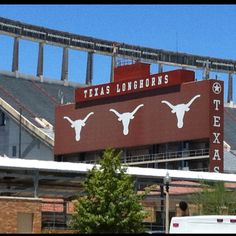 the texas longhorns stadium sign is in front of an empty bleachers