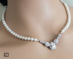 Wedding White Pearl Cubic Zirconia Silver One Strand Classic Bridal Backdrop Statement Necklace. NECKLACE is about 17.71 inches (45cm) long. BACKDROP is 6.77 inches (17.2cm) long. BRIDAL NECKLACES SECTION: https://www.etsy.com/shop/LanaChayka?ref=seller-platform-mcnav§ion_id=11638944 JEWELRY SETS SECTION: https://www.etsy.com/shop/LanaChayka?ref=seller-platform-mcnav§ion_id=18873488 BRIDAL JEWELRY SETS SECTION: https://www.etsy.com/shop/LanaChayka?ref=seller-platform-mcnav§ion_id=25839214 Elegan Elegant White Pearl Necklace For Marriage, Vintage Pearl White Necklace For Wedding, Elegant Pearl White Gold-plated Necklaces, Vintage Pearl White Bridal Necklace, Luxury White Pearl Necklace, Elegant Style, Bridal Backdrop, Bridal Necklaces, Pearl Statement Necklace, Zirconia Necklace