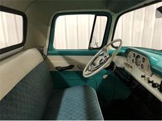 the interior of an old truck is clean and ready to be used