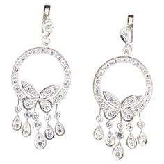 A chic and cute pair of diamond white gold earrings. They feature 4.12 carats of round brilliant-cut diamonds set around the earrings in pear-drops and in the shape of butterflies. They are made in 18k white gold with a very strong and sturdy feeling. The lower drops of the earrings each move independently from each other adding great movement and flow to the piece. Ready to be worn! Length: 2.1 inches Weight: 24.4 grams Luxury White Gold Sterling Silver Cluster Earrings, Gold Butterfly Earrings, Butterfly Earrings Gold, White Gold Earrings, Gold Butterfly, Diamond Drops, Butterfly Earrings, Round Brilliant Cut Diamond, Brilliant Cut Diamond