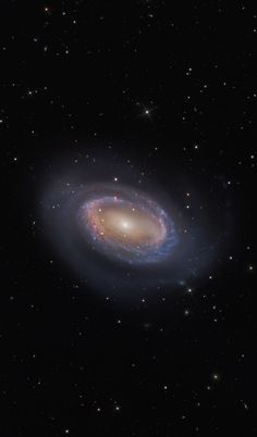 a spiral galaxy with stars in the background