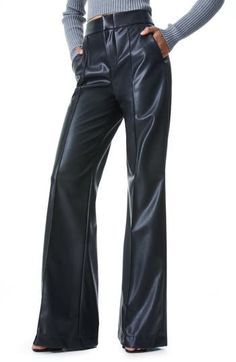 Step out like a '70s icon in these totally boss faux-leather pants, fashioned with a sky-high waist, wide-swept legs and all the swagger of the real deal. Zip fly with hook-and-bar closure Side-seam pockets Lined 100% polyester with 100% polyurethane face Dry clean Imported Women's Clothing Leather Wide Leg Pants, High Waist Wide Leg Pants, Alice And Olivia, Faux Leather Pants, Black Faux Leather, Alice Olivia, Wide Leg Trousers, Fashion Pants, Leg Pants