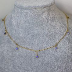 Blue Sapphire Necklace Cornflower Blue Natural Sapphire Necklace Gift for her solid 14K Yellow Gold 38- 42cm length. Introducing our captivating dainty yellow gold station necklace, adorned with seven mesmerizing pieces of vivid blue sapphire. Each gemstone embodies a fiery intensity, carefully chosen and expertly set to create a striking contrast against the warm glow of the gold. This necklace is designed to add a bold pop of color and sophistication to any attire, making it a versatile choice Blue Dainty Necklace With Clavicle Chain, Dainty Blue Clavicle Chain Necklace, Dainty Blue Necklace With Delicate Chain, Fine Jewelry With Blue Delicate Chain, Blue Birthstone Gold-plated Jewelry, Blue Birthstone Jewelry In Gold Plated, Blue Fine Jewelry With Delicate Chain, Blue Gold-plated Birthstone Jewelry, Blue Fine Jewelry With Adjustable Chain