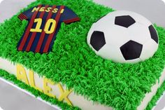 a soccer ball and jersey cake on top of green grass with the number 10 in it